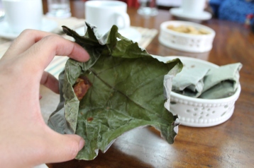 Unfold the aromatic, dried pili nut leaf wrapping